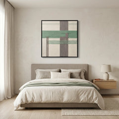 Framed geometric hand-woven wool wall art styled in a tranquil bedroom as a soft focal point above a modern bed with neutral bedding.