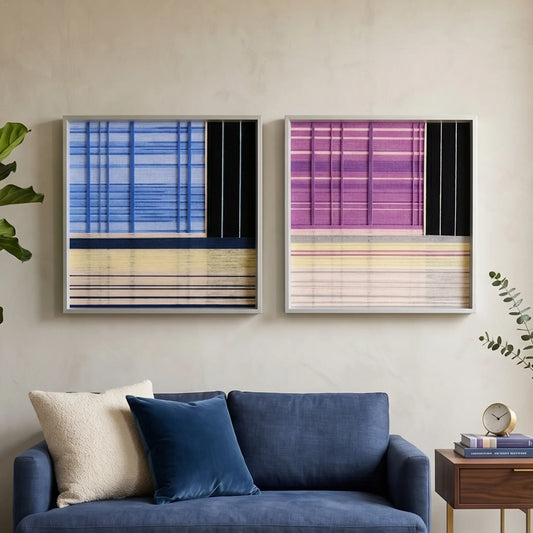 A diptych set of square hand-woven wool wall art featuring abstract plaid patterns in blue, purple, and black with yellow accents, styled above a navy blue velvet sofa.