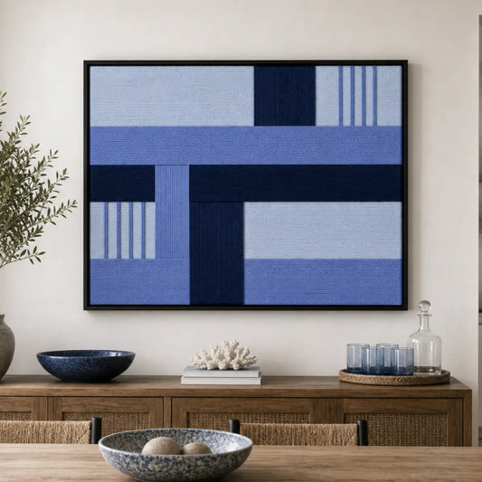 Hand-woven wool tapestry beautifully staged in a warm dining room or lounge area, hanging over a rustic wooden sideboard with ceramic bowls.