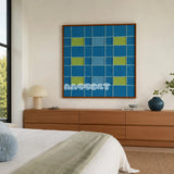 North Sea Poem blue and lime green geometric yarn wall art displayed above a wood dresser in a serene modern bedroom.
