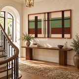 Olive Passage RE091 framed fiber wall art above a console table in a sunlit entryway beside a curved staircase