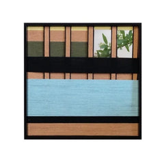 Close-up of Outside The Window wool yarn art showing tight weave detail and color contrast between soft blue panel and earth-tone stripes.
