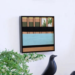 Outside The Window wall art styled on a desk beside greenery, highlighting its crisp stripe transitions and exact square format.
