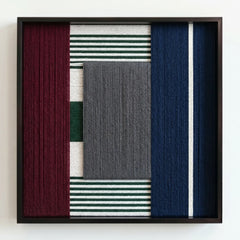 Frontal studio shot of the "Overture of Dusk & Dawn" fiber art featuring vertical navy and deep red wool blocks in a black frame.