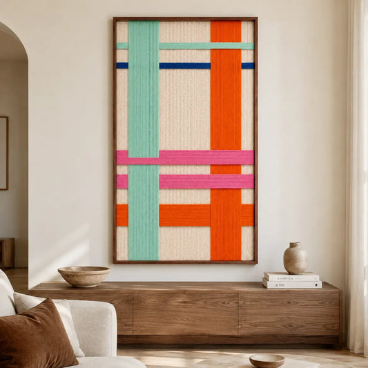 Contemporary living room decor featuring the framed textile art hanging gracefully on a neutral wall above a modern wooden media console cabinet.