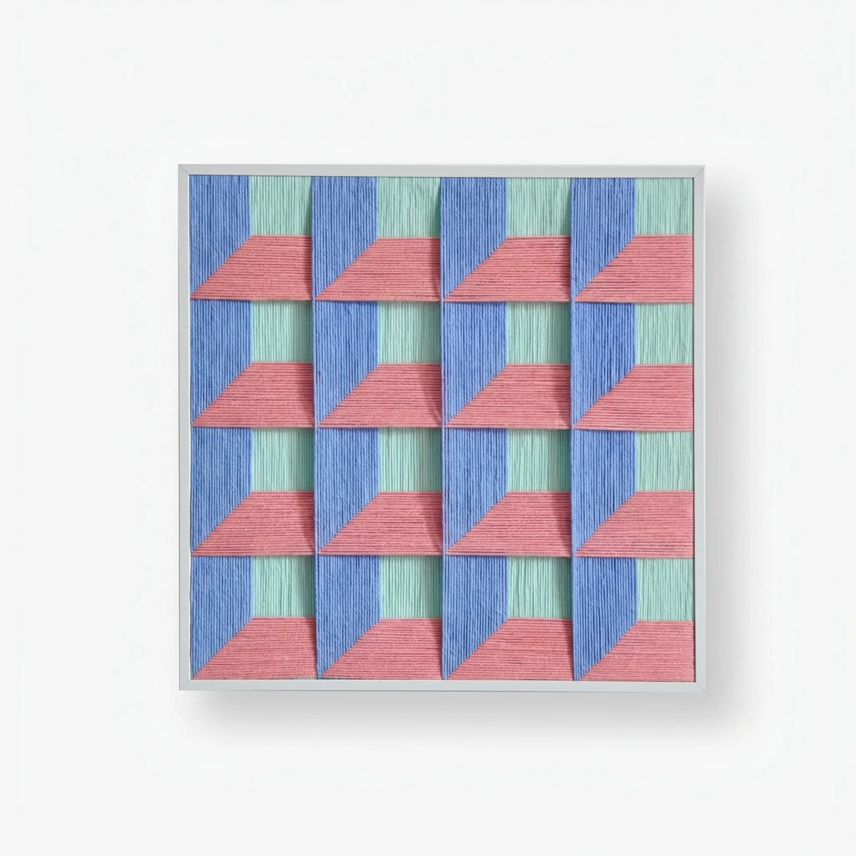 Whispering Bricks framed textile artwork featuring layered pink bands over a precise purple and muted blue triangular pattern.