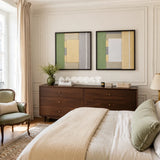 Framed Sun-Baked textile wall art with buttery cream, white, sage, slate, and pale yellow blocks in a refined room.