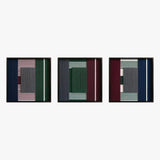Front studio view of the Overture of Dusk and Dawn triptych with three square textured textile artworks in black frames.