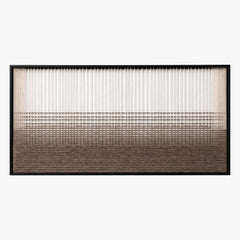 Frontal studio shot of the Quiet Thread hand-woven wool wall art featuring a serene gradient pattern in a black frame.