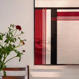 Angled view of Napoli RE002 textile art showing precisely arranged soft cotton cord, bold red and black panels, and clean geometric lines.