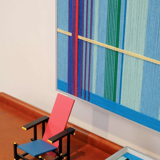 Summer Story RE004 yarn wall art displayed on a laptop, highlighting its compact framed format and cheerful yellow and violet grid design.