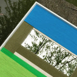 Inspiration image for Riverside RE006 textile mirror art highlighting its tranquil riverside mood and blue-green landscape palette.