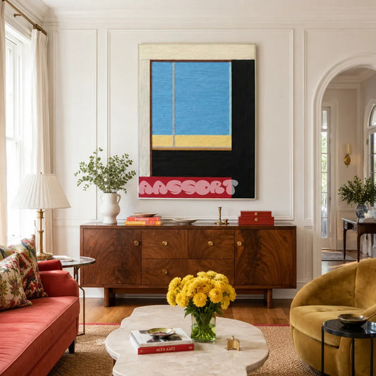 After the Beach Walk RE007 framed textile art with pastel blue, lavender, pink, red, and orange geometric yarn blocks displayed in a coastal interior.