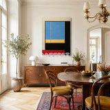 After the Beach Walk RE007 framed fiber artwork featuring sunset-inspired pink, red, blue, lavender, and orange yarn in a modern interior.