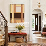 Rohmer RE014 framed fiber artwork featuring layered brown, tan, yellow, and cream yarn structures in a modern interior.