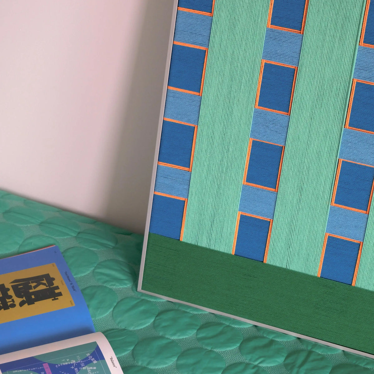 Endless Summer in Hawaii RE017 vertical textile wall art displayed on a teal bedspread in a relaxed summer setting.