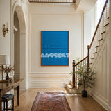 Submersion RE018 abstract blue textile artwork with architectural relief presented in a stylish contemporary interior.