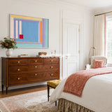 Summer Letter RE019 abstract coastal textile artwork with vibrant geometric color blocking presented in a stylish interior.