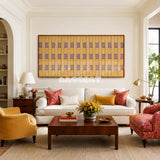 Lavender Fields RE021 panoramic framed textile art with golden yellow and muted lavender geometric yarn displayed in a modern interior.