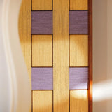Close-up of Lavender Fields RE021 textile art showing intricate golden yellow and purple yarn winding and its framed edge.
