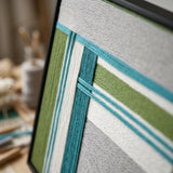 Detailed side view of Silent Stream RE023 framed textile art showing the depth and three-dimensional yarn winding.