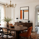 Sunset Construct RE024 orange and charcoal geometric textile wall art styled as a warm architectural focal point in a contemporary room.