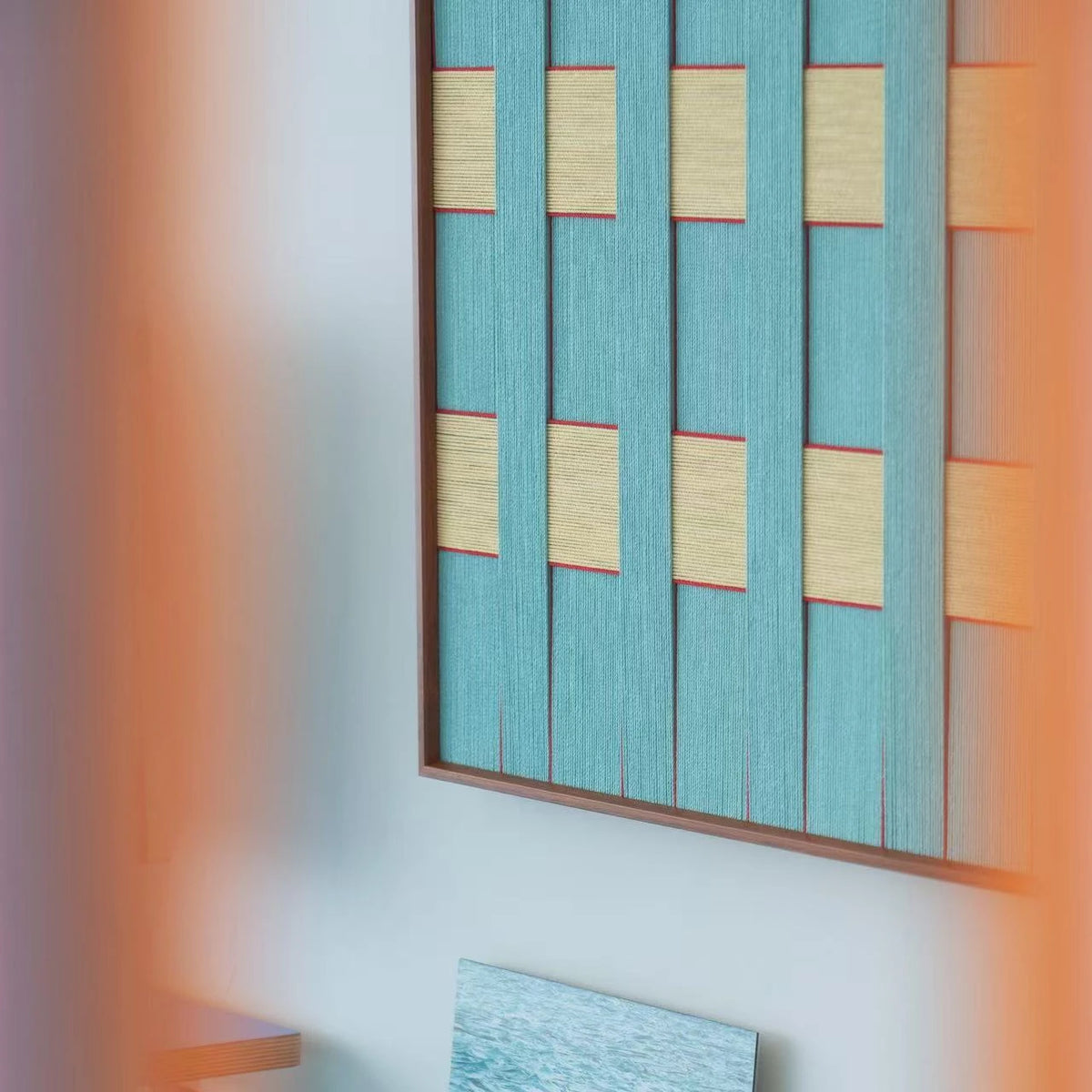 Close-up side view of Afternoon Window Landscape RE026 textile art showing thick teal yarn and the depth of its frame.