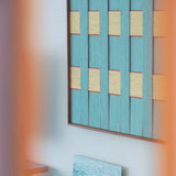 Close-up side view of Afternoon Window Landscape RE026 textile art showing thick teal yarn and the depth of its frame.