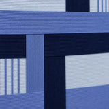 Macro close-up of Nordic Tide RE028 textile art highlighting thick navy and light blue intersecting soft cotton cord.