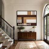 Cocoa Loom RE029 framed textile art with white, cocoa brown, golden wheat, and warm tan geometric yarn displayed in a mid-century interior.