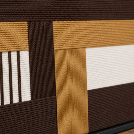 Macro close-up of Cocoa Loom RE029 textile art highlighting thick brown, beige, and white intersecting soft cotton cord textures.