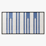 Front view of Blue Cadence RE031 blue and ivory striped textile wall art in a black frame on a white background.