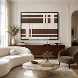 Earthen Bands RE034 framed textile art with warm ivory, cocoa brown, and cream geometric yarn displayed in a modern interior.