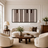 Cocoa Pillars RE035 panoramic framed textile art with warm ivory and cocoa brown vertical yarn bands displayed in a modern interior.