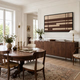 Framed Cocoa Grid woven wall hanging with structured brown and cream grid patterns in a refined room.