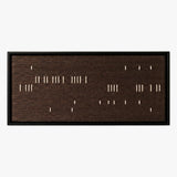 Front studio view of Cocoa Whispers textured wall art with scattered white vertical stitches on a dark brown background in a black frame.