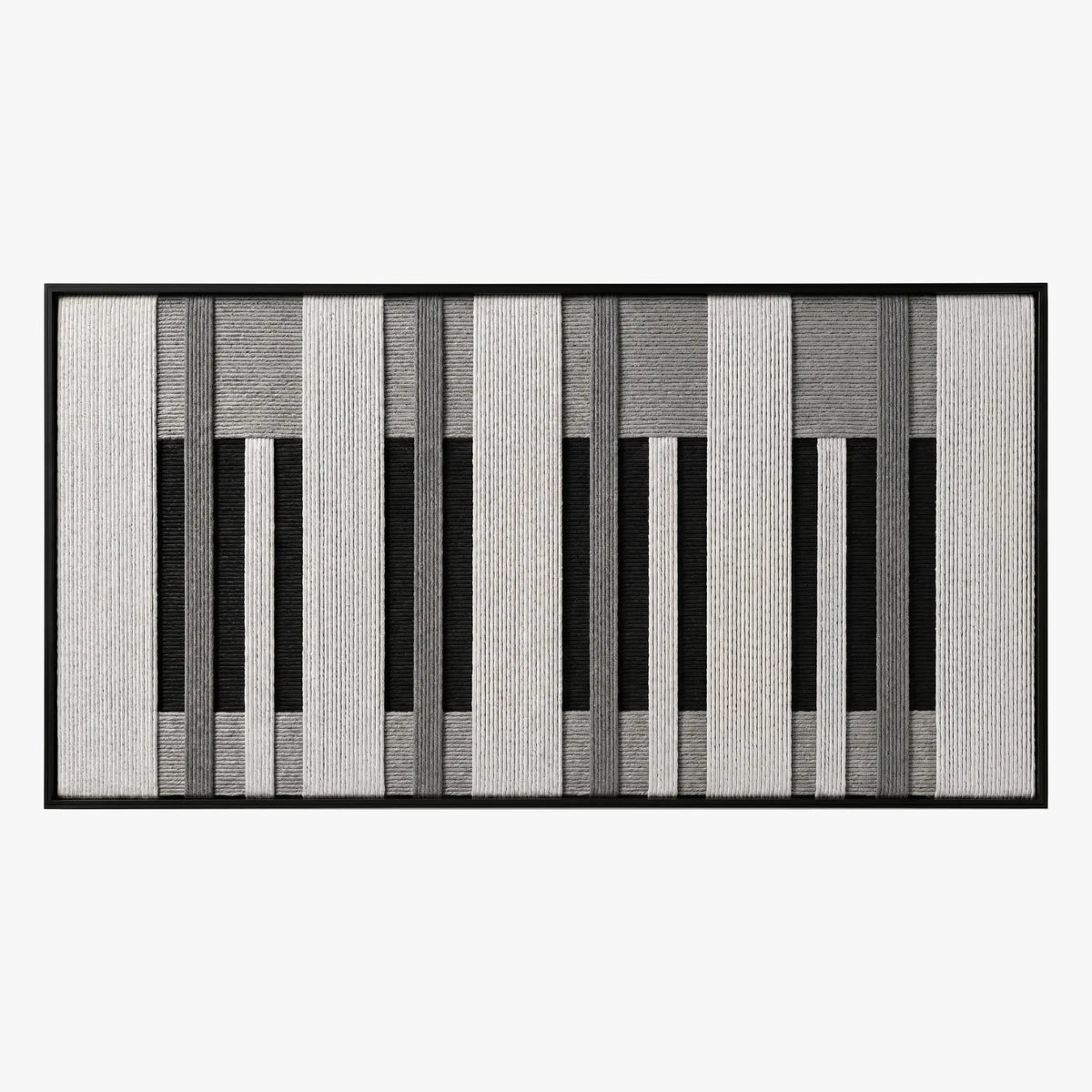 Front studio view of Monochrome Tempo textured wall art featuring a black, white, and grey piano-key geometric pattern in a black frame.