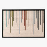 Front studio view of Chromatic Rain textured wall art featuring colorful vertical yarn stripes on a beige background in a black frame.