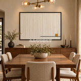 View of Last Note framed textile wall art, featuring ivory vertical cotton cord strands with a thin black line and a small golden ochre accent.