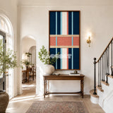 Framed Pittsburgh Prelude woven wall hanging with navy, peach, coral, light blue, and cream geometry in a refined room.