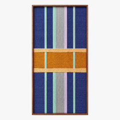Full product shot of the vertical hand-woven wool wall art in a sleek wooden frame, highlighting its geometric pattern and mustard block.