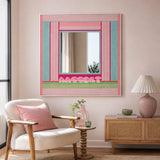 Secret Crush colorful yarn-framed mirror displayed above a cane cabinet beside a cream lounge chair in a pastel reading corner.
