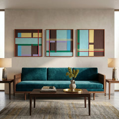Three-piece woven textile wall art set creating a stunning focal point in a contemporary living room above a teal velvet sofa.