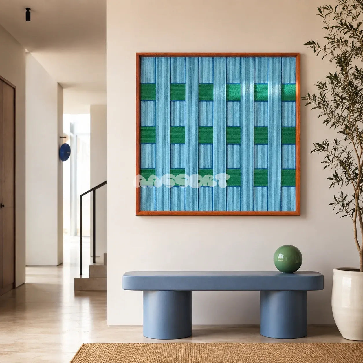 Seine Riverbank blue and green geometric yarn wall art displayed above a blue console in a bright modern entryway.