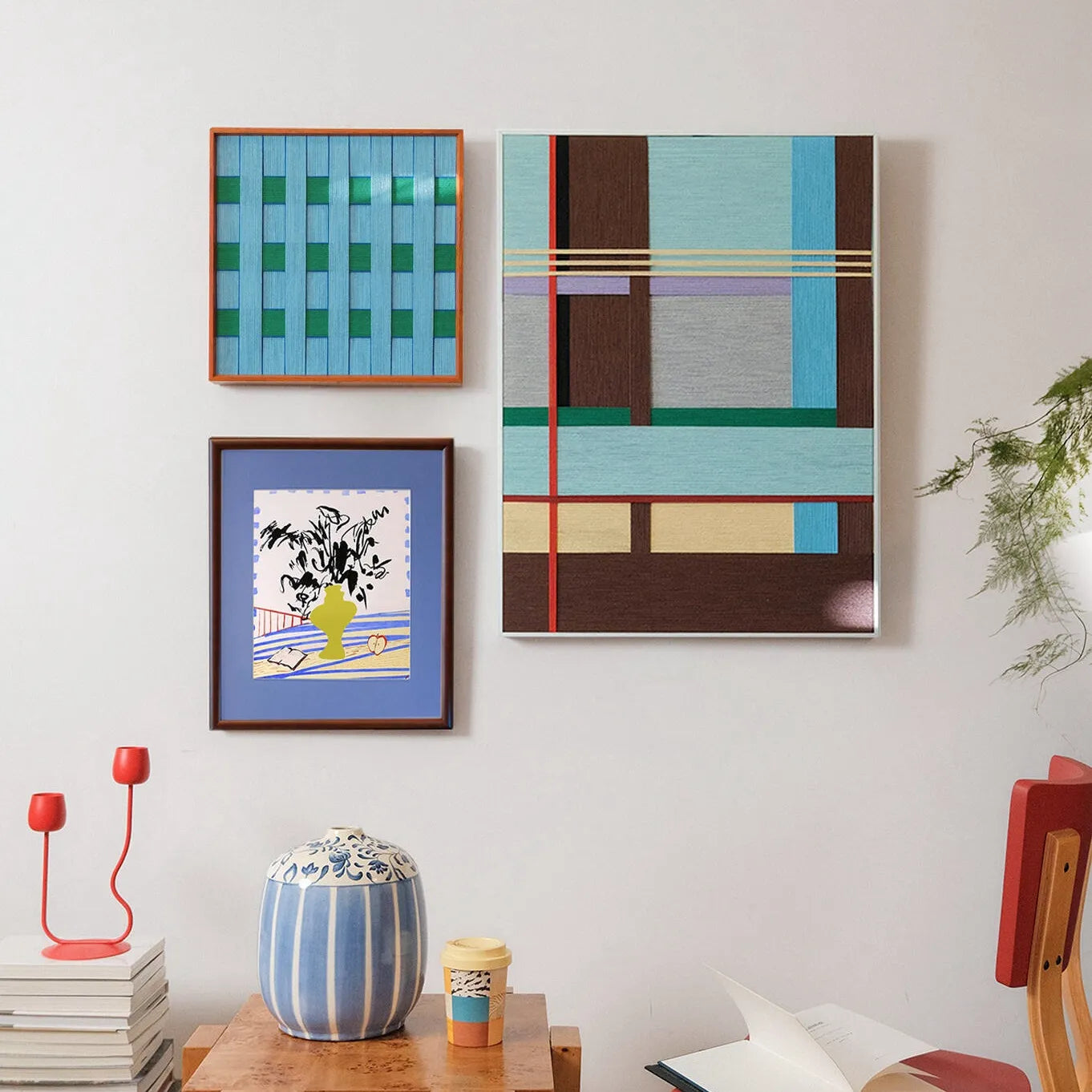 Seine Riverbank wall art displayed alongside other framed pieces in a gallery-style arrangement, illustrating its complementary color palette
