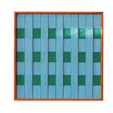 Hand-held view of Seine Riverbank yarn wall art showing its sturdy frame and easy-to-hang compact size
