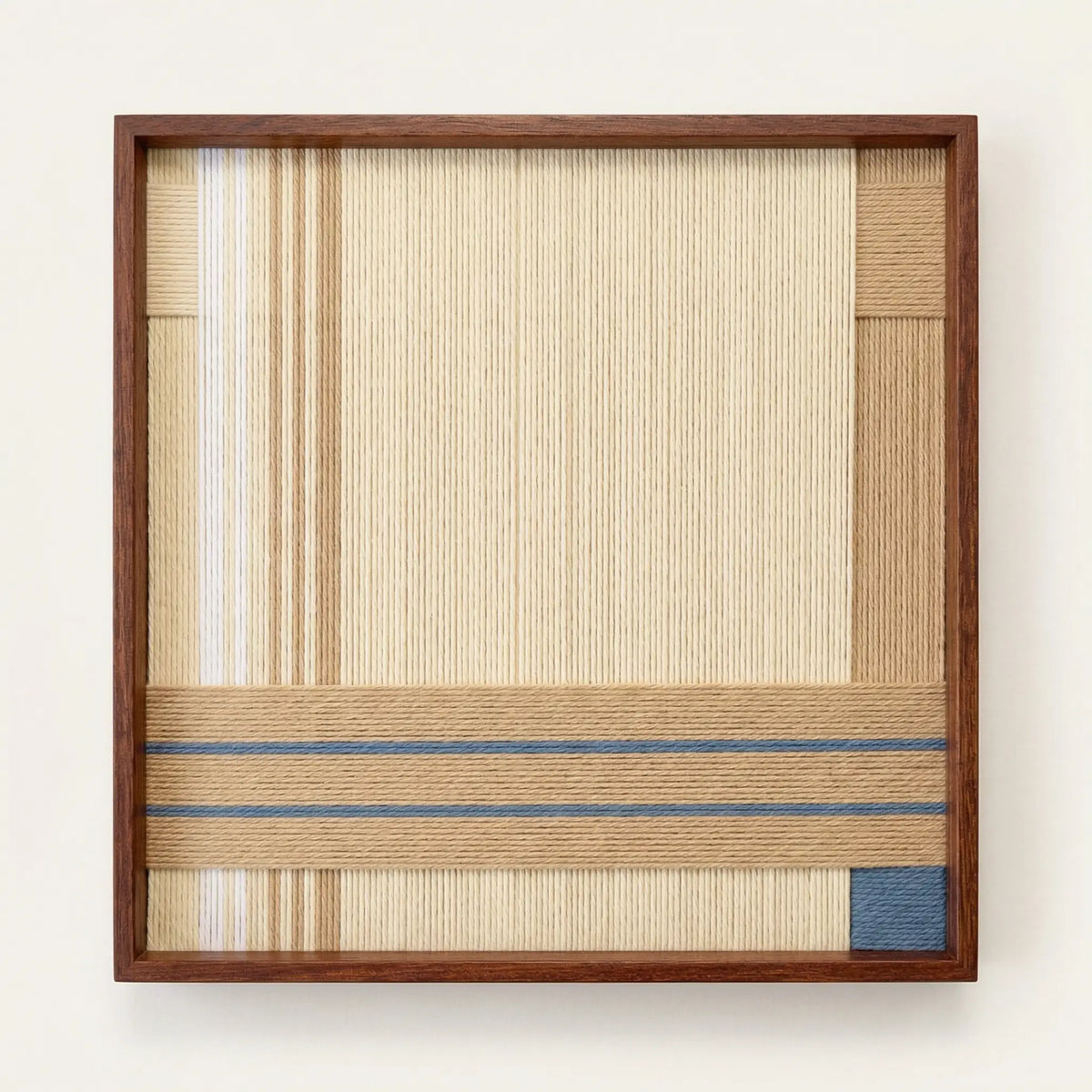 Frontal studio shot of the Shadow at 4 PM soft cotton cord wall art in a square wooden frame against a white background.