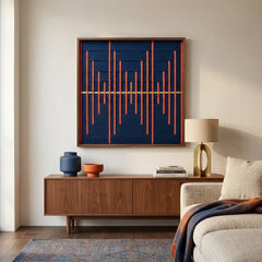 Modern wool wall decor styled in a living room above a dark wood sideboard, emphasizing the bold orange and blue color palette.