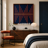 Signal Lost navy and orange textile wall art displayed above a wooden dresser in a warm modern bedroom.
