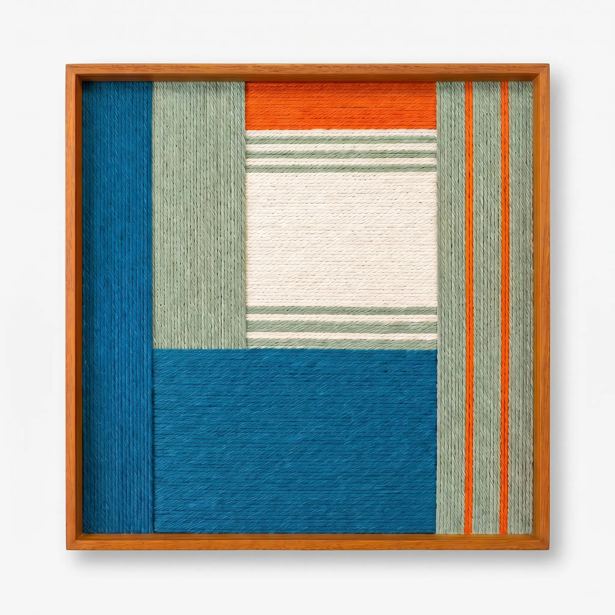Frontal studio shot of the Silent Theatre soft cotton cord wall art in a square oak-finish frame against a clean white background.
